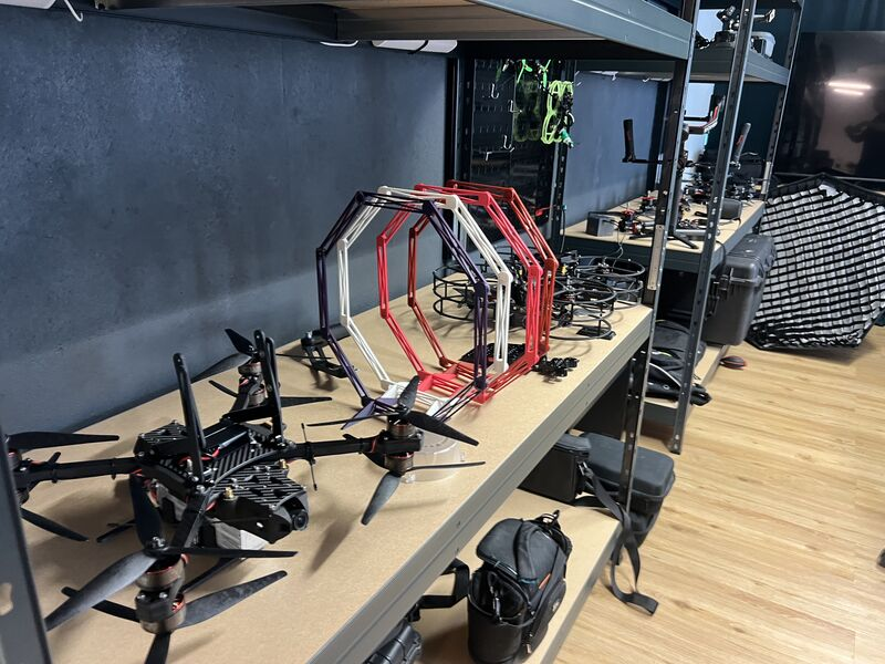 FPV drones and rigs on a shelf