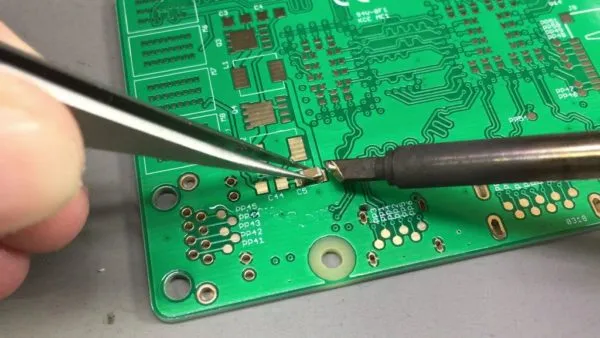 Hand-soldering a custom PCB